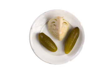Sauerkraut and pickles on a white dish. Isolated on white. Vegetarian food, vitamins