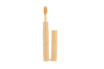 Natural bamboo toothbrushe packed in reusable paper tube isolated on white for your creative design. Sustainable lifestyle and plastic free concept, bathroom essentials, mockup