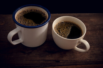 Cup of coffee on old wooden table