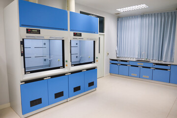 Laboratory fume hoods in science classroom interior of university college for protect the user from inhaling toxic gases (fume hoods, biosafety cabinets, glove boxes).