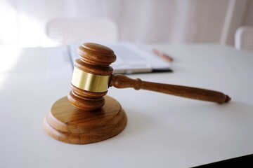 Judge gavel hammer on Lawyer desk.