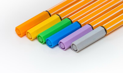 Set of colored markers on white background