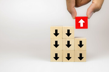 Businessman hand choose cube wooden toy blog with arrow icons concept of business for change leader to growth and success.