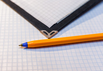 Album and pen on white background