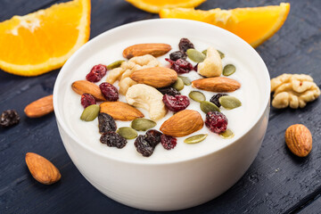 A bowl of yogurt nuts breakfast