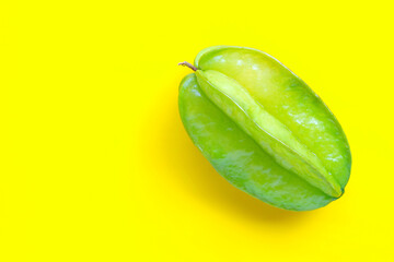 Star fruit on yellow background.