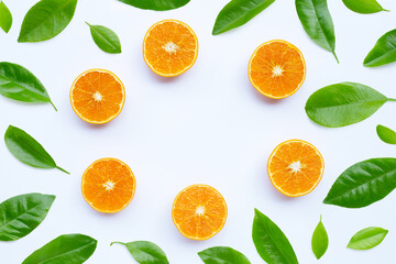 High vitamin C, Juicy and sweet. Frame made of orange fruit with leaves on white background.