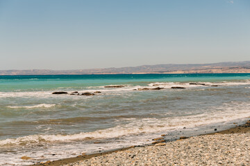 beautiful azure sea and pebble beach. High quality photo