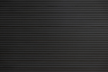 black steel wall background and texture. black metal shutter door.