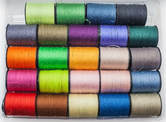 A set of colored threads on the coils