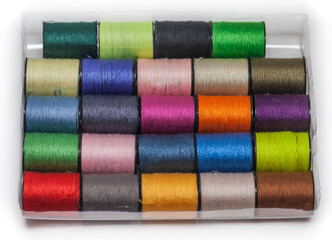 A set of colored threads on the coils