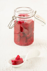 homemade pickled beetroots in jar on wooden table