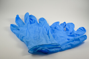 Blue latex gloves with white background