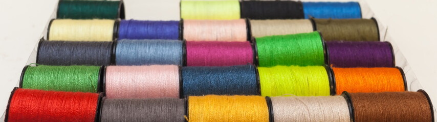 A set of colored yarn on a white background