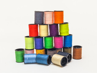 Coil set with colored thread on a white background