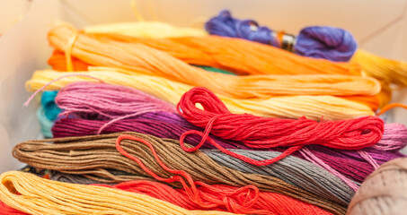 Skeins of colored threads for embroidery