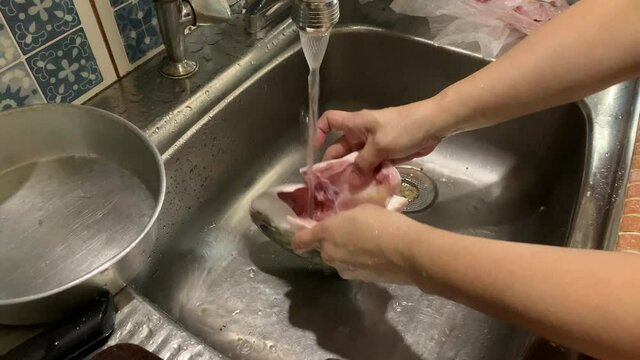 Preparing Golden Pomfret Fish Head For Steamed Fish. Washing and Cleaning of Insides.