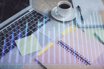 Multi exposure of forex graph drawing and desktop with coffee and items on table background. Concept of financial market trading