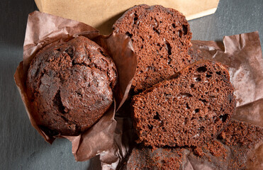 Close-up of dessert chocolate brownie cupcakes on dark background