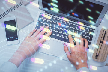 Double exposure of woman hands working on computer and data theme hologram drawing. Top View. Technology concept.