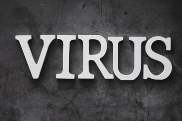 Medical background. Lettering virus. Coronavirus wooden letters. Background of the deadliest pandemic virus in the world. Vaccine for the virus.