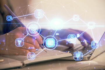 Double exposure of woman hands typing on computer and social network theme hologram drawing. People media concept.