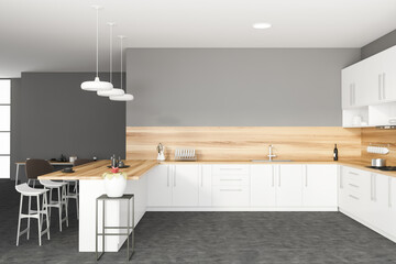 White and gray kitchen with bar, side view