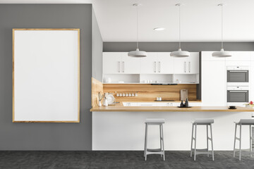 White and gray kitchen with bar and poster