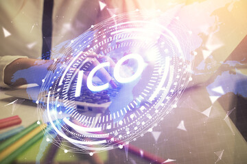 Double exposure of woman hands typing on computer and crypto market theme hologram drawing....