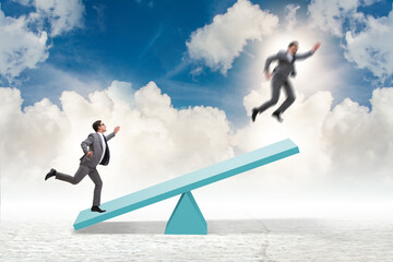 Competition concept with businessman and seesaw
