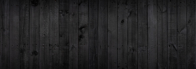 Black wood texture background coming from natural tree. The wooden panel has a beautiful dark...