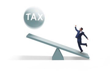Businessman in tax concept with seesaw