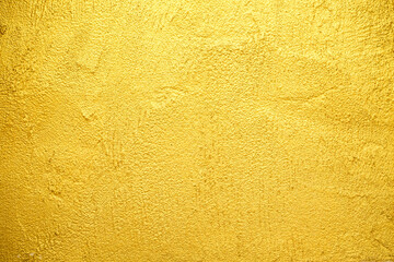 Golden wall texture rough background abstract concrete floor or Old cement grunge background with Gold empty.