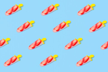 Trendy summer pattern made of strawberry ice cream popsicle on blue isometric background. Minimal geometry style.