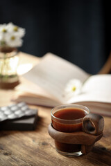 Beautiful cup of coffee on a wooden table.
