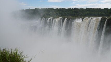 Views of the spectacular Iguazu waterfall on a sunny day i from many points of view