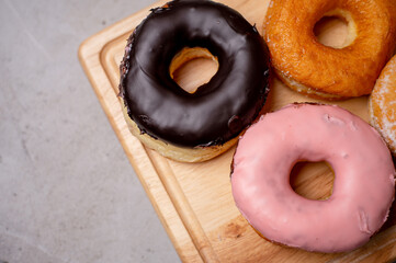 Donuts, Strawberry flavor, Chocolate flavor, Donut with sugar, Donuts coconut on woodplate