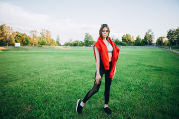A young girl goes in for sports at the stadium. Sport lifestyle concept