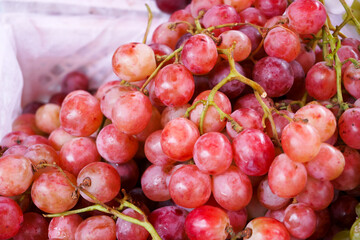 Fresh red grapes fruits at maket