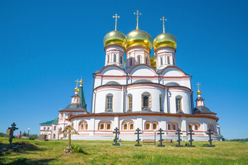 Cathedral of the Icon of the Mother of God of Iverskaya close-up on a background of blue sky. Valdai Iversky Holy Lake Mother of God Monastery. Novgorod region, Russia