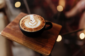 cup of coffee on table in cafe, vintage style copy space