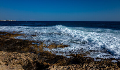 Fototapeta na wymiar Rocky beach on the Mediterranean coast on the Akamas Peninsula on the island of Cyprus.