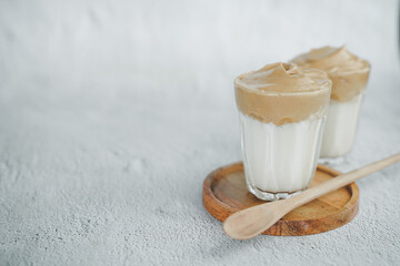 Iced Dalgona Coffee, a trendy fluffy creamy whipped coffee. Summer iced coffee.with copyspace for your text.