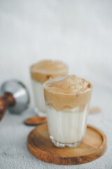 Iced Dalgona Coffee, a trendy fluffy creamy whipped coffee. Summer iced coffee.with copyspace for your text.