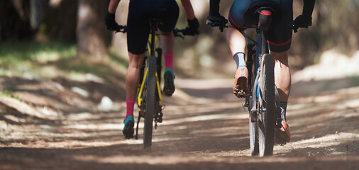 Fototapeta na wymiar Mountain bikers riding on bike singletrack trail, mountain bike race