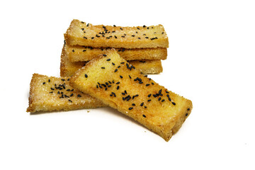 Slice toast bread with butter and black sesame seed on white background.