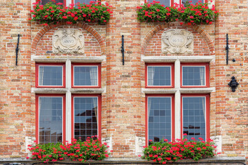 Fototapeta na wymiar window with flowers on a old house in Bruges, Belgium