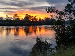Golden River Sunset with Reflections