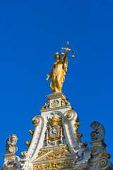 golden statue on City Hall of Bruges, Belgium