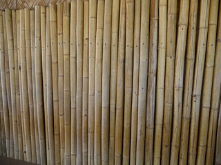 Brown bamboo posts used as a wall